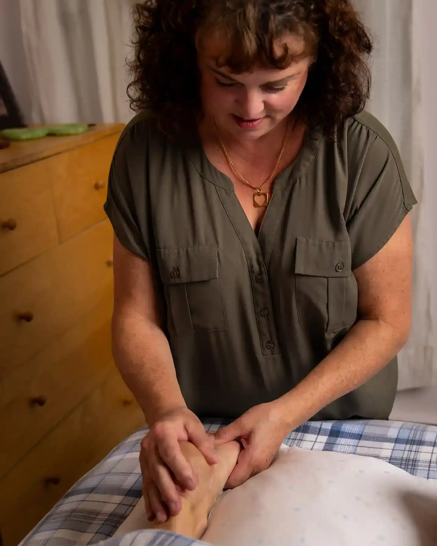 A picture of Heather massaging a foot